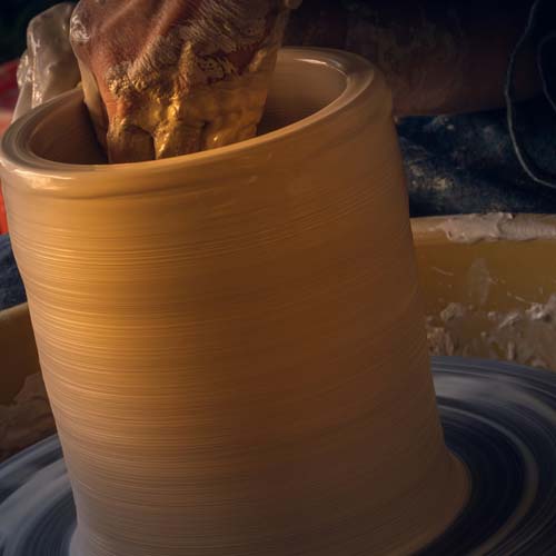 Picking up a porcelain cup from a porcelain plate that is on a wooden surface 04 Main Image