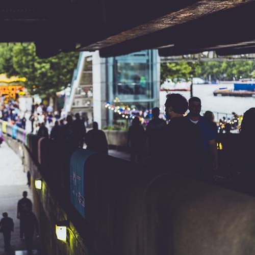 A discontent small crowd is complaining and grumbling 01 Main Image